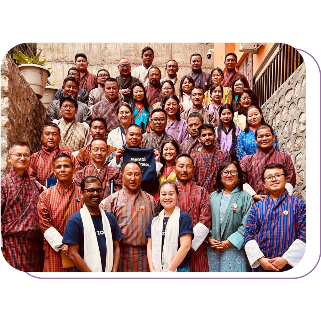 Zoala's members are having picture with educators and counsellors in Bhutan
